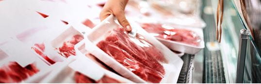 Meat packages in a supermarket shelf