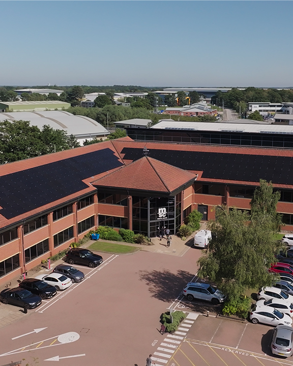 The MSC UK Headquarters in Ipswich, located adjacent to the A14, with solar panels visible on the roof, showcasing the company's commitment to sustainability.