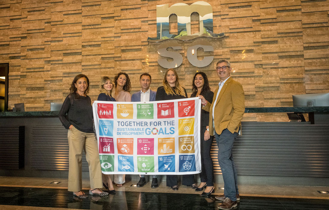 MSC Sustainability team raising SDG Flag