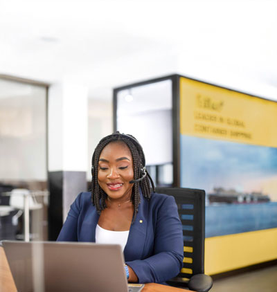 MSC Employee working in the office talking on the phone with a customer
