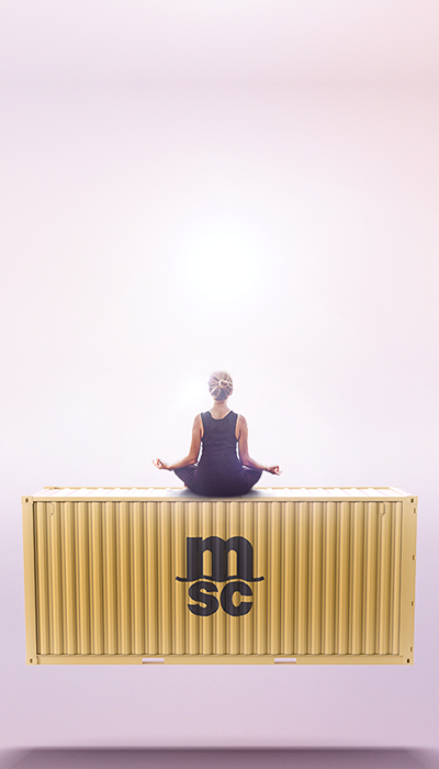 woman doing yoga on a container